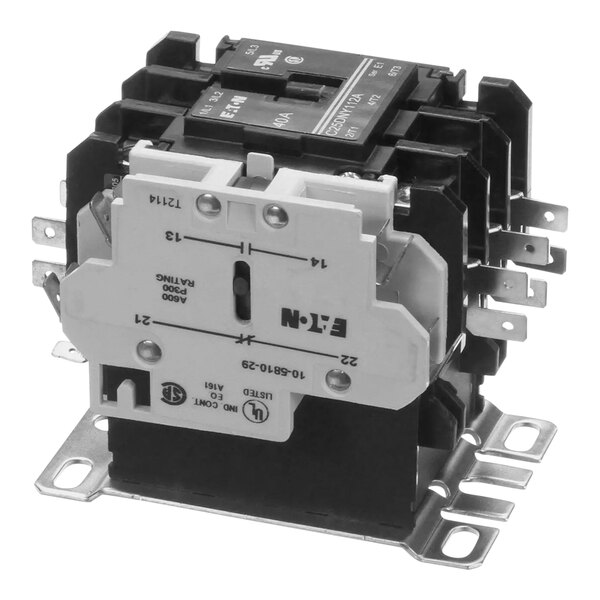 A white electrical contactor with black text on it and two terminals and switches.