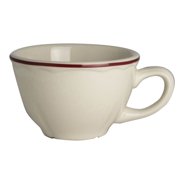 A white Homer Laughlin china cup with a red rim.