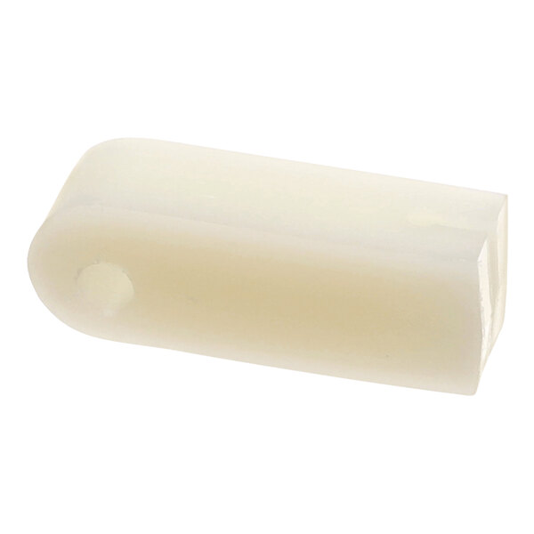 A white plastic Hobart saw blade guard tube with a hole.