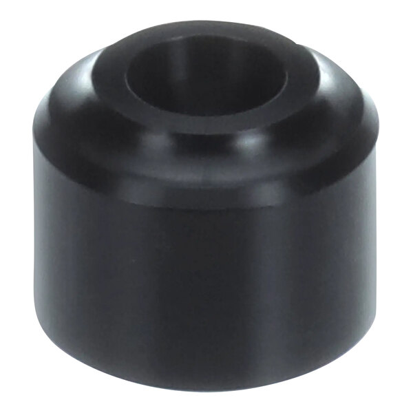 A close-up of a black Hobart knob with a hole in the center.
