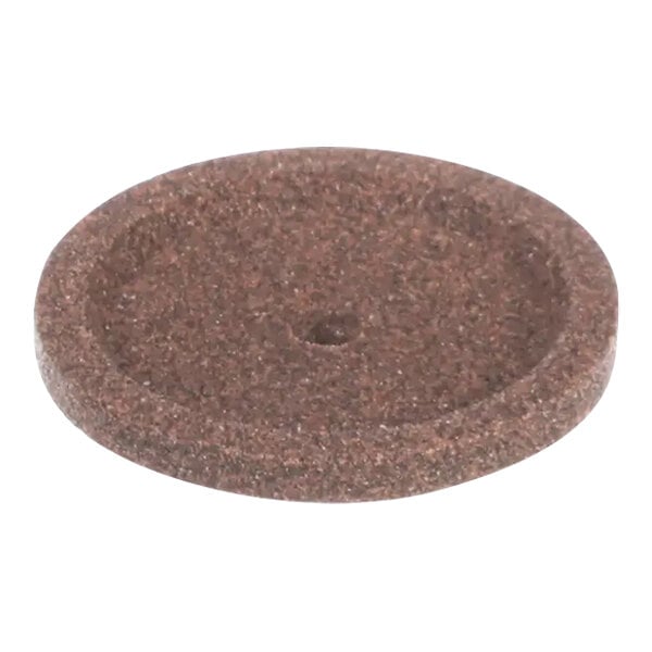 A brown circular grinding wheel with a hole in the center.