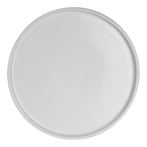 A close-up of an Anfora Crete white china plate with a round rim.