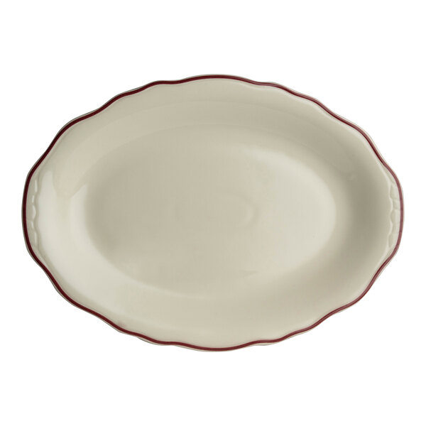 A white oval platter with maroon scalloped trim.