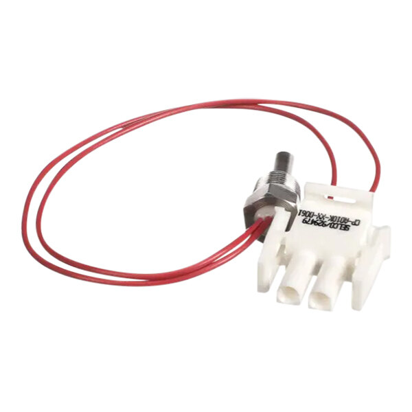 A white and red wire with a metal connector attached to a red device.