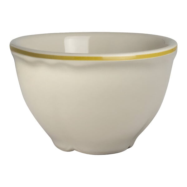 A white Homer Laughlin china bowl with a yellow rim.