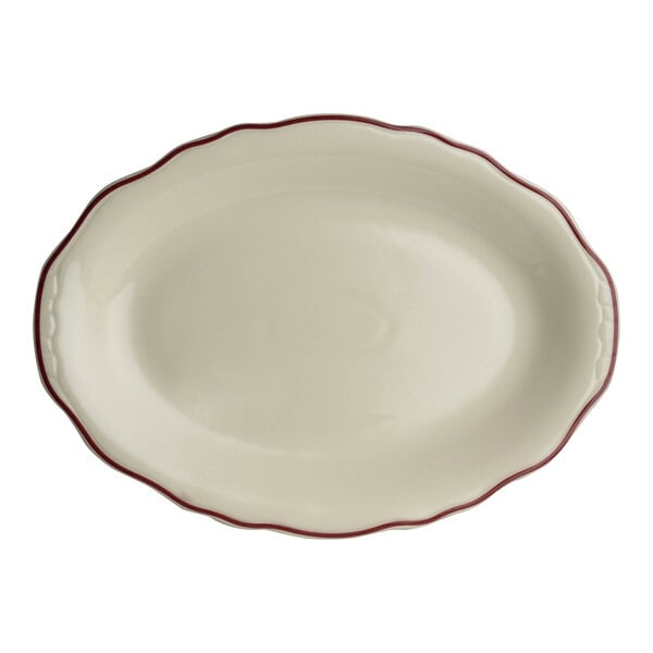 A white oval platter with maroon trim.