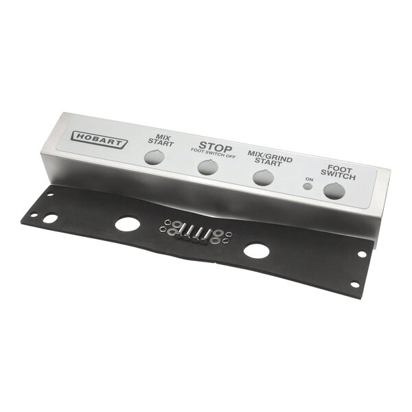 A metal plate with four holes and two holes with start and stop switches.