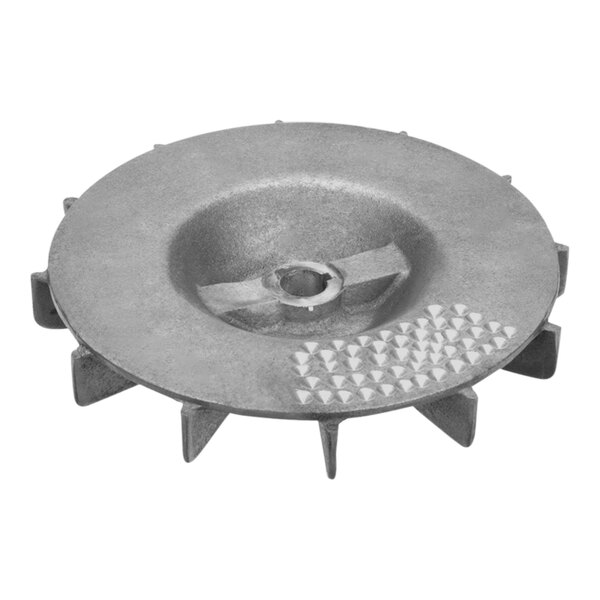 A circular metal disc with spikes.
