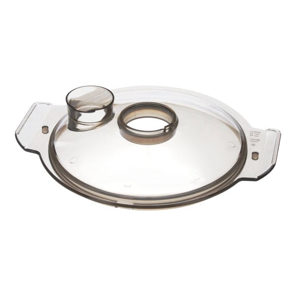 A clear plastic lid with a round hole.