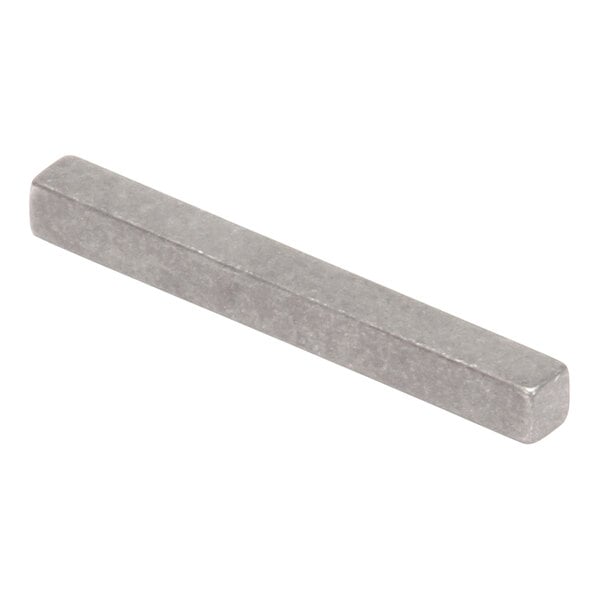 A close-up of a rectangular metal bar with a square shape at one end.