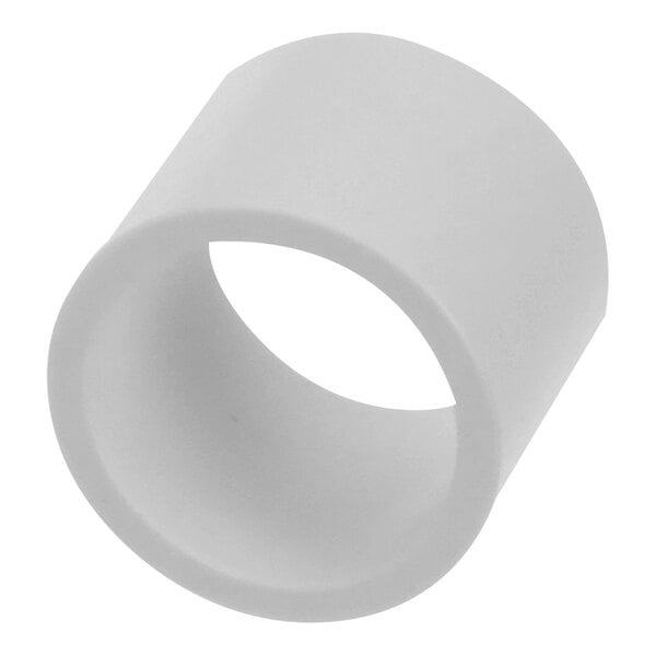 A white cylindrical object with a hole in the middle.