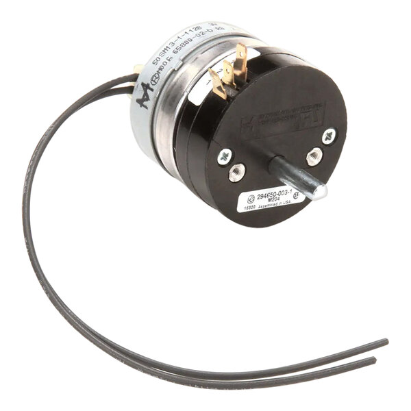 A Hobart 00-294650-003-1 Timer, a small round black and silver device with wires.