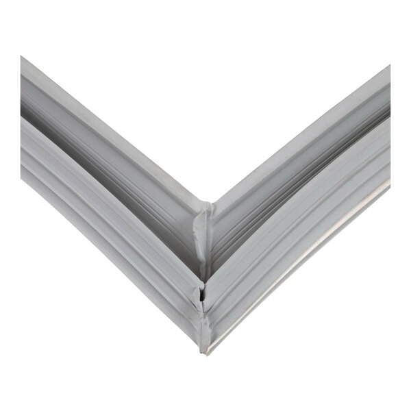 A close-up of a white plastic profile on a silver metal frame.