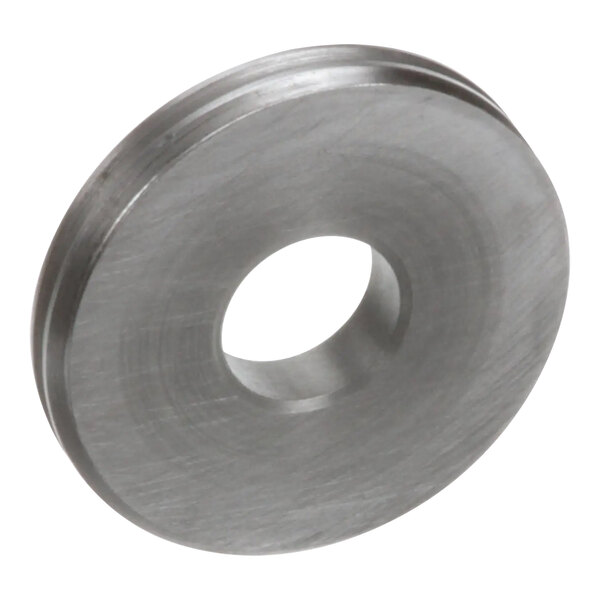 A stainless steel circular disc with a hole in it.