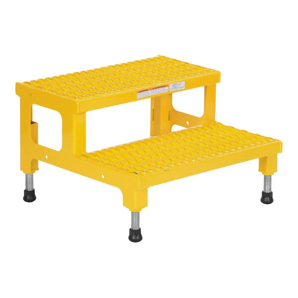 A yellow Vestil steel step stool with black legs.