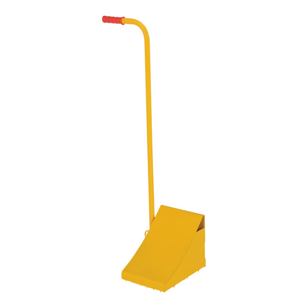 A yellow steel wheel chock with an ergonomic handle.