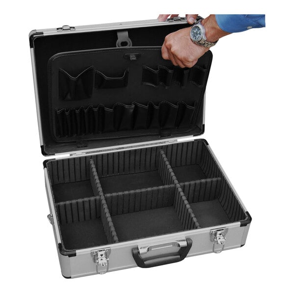 A hand opening a silver aluminum Vestil tool carrying case with compartments for tools.