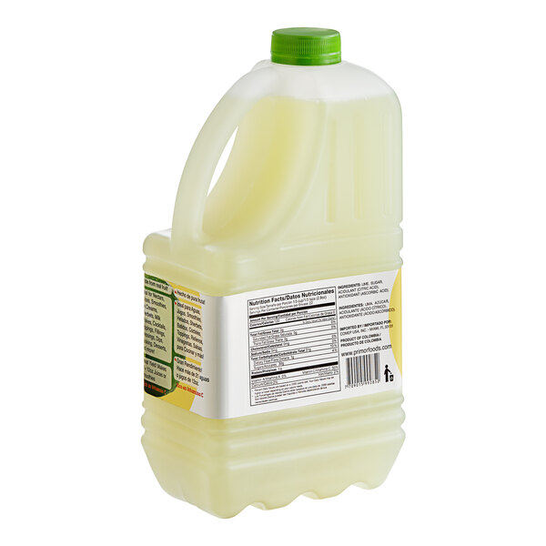 A close-up of three plastic containers of Primor Lime Puree with green caps.