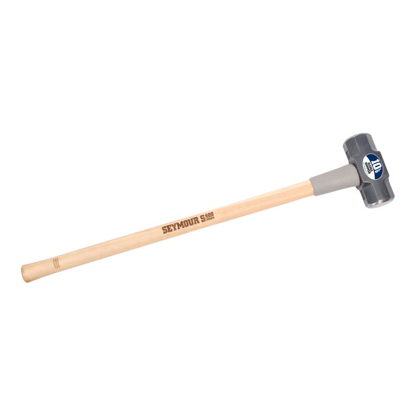 A Seymour Midwest sledge hammer with a wooden handle and a blue logo.
