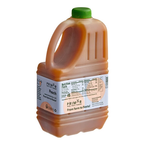 A 64 fl. oz. plastic jug of Primor peach puree with a green cap and labeled nutritional information.