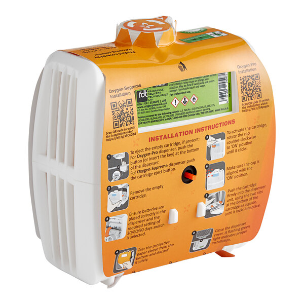 A white and orange box for Oxy-Gen Powered Grande Charm Metered Air Freshener Cartridge Refills.