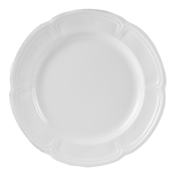 A close-up of a Steelite Monique white plate with a decorative edge.