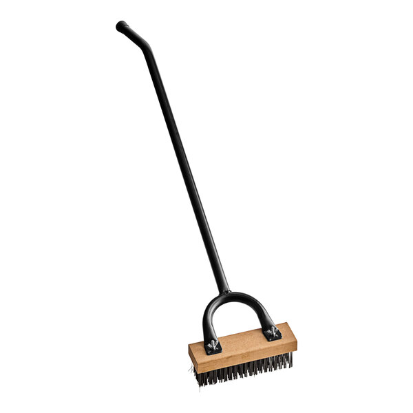 A black and brown Choice grill brush with a long handle.