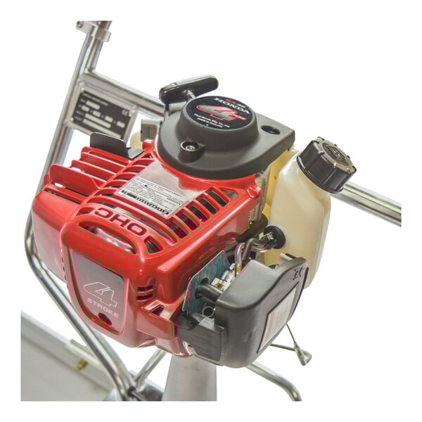 A red and black Tomahawk concrete power screed machine with a Honda engine.