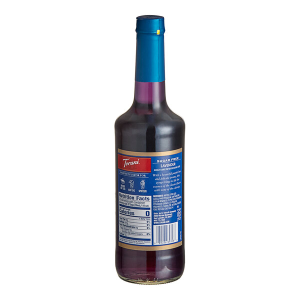 A Torani Sugar-Free Lavender Flavoring Syrup bottle with purple liquid, a blue label, and a red lid.