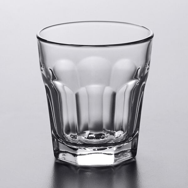 A Libbey Gibraltar clear glass with a scalloped edge.