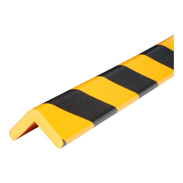 A black and yellow striped Ideal Warehouse corner guard.