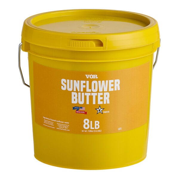 A yellow Vor sunflower butter pail with a lid.