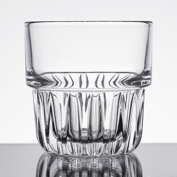 A close up of a Libbey Everest clear glass with a faceted rim.