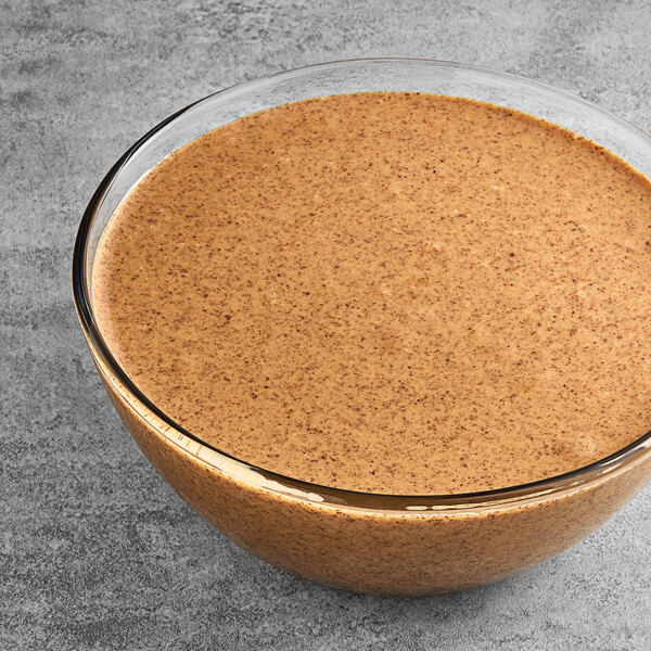 A table with a bowl of Vor Almond Butter.
