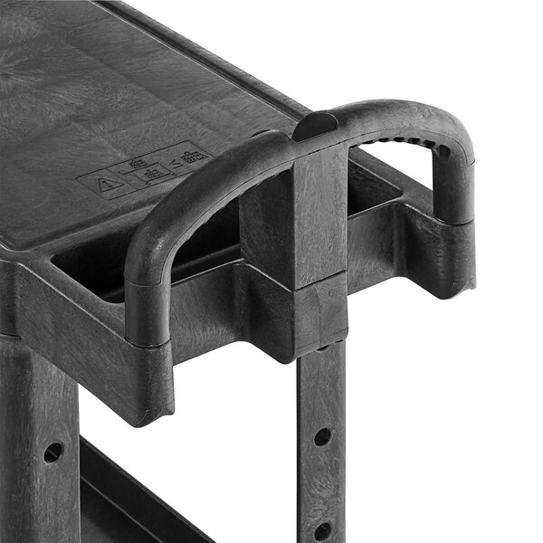 A black Rubbermaid plastic utility cart with two shelves and an ergonomic handle.