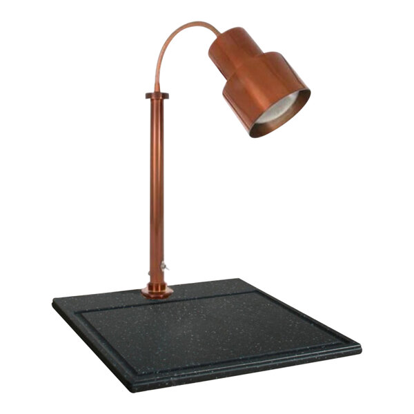 A copper Hanson Heat Lamps carving station lamp on a black surface.