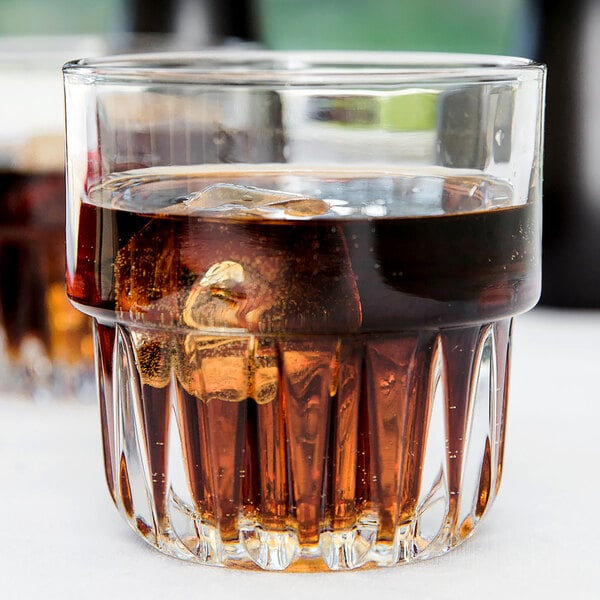 Two Libbey Everest stackable rocks glasses filled with cola and ice.