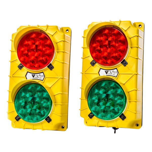 A yellow Ideal Warehouse Stop & Go traffic light with red and green lights.