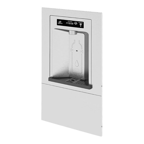 A Haws stainless steel recessed bottle filler with a screen over the water dispenser.