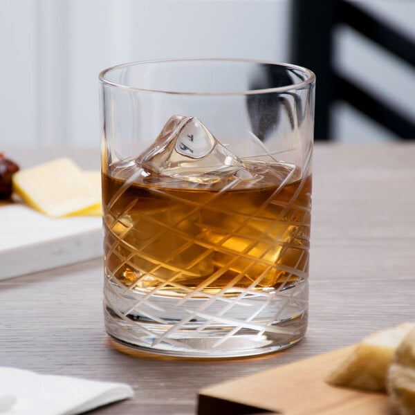 A Reserve by Libbey Crosshatch Rocks glass with ice and whiskey.