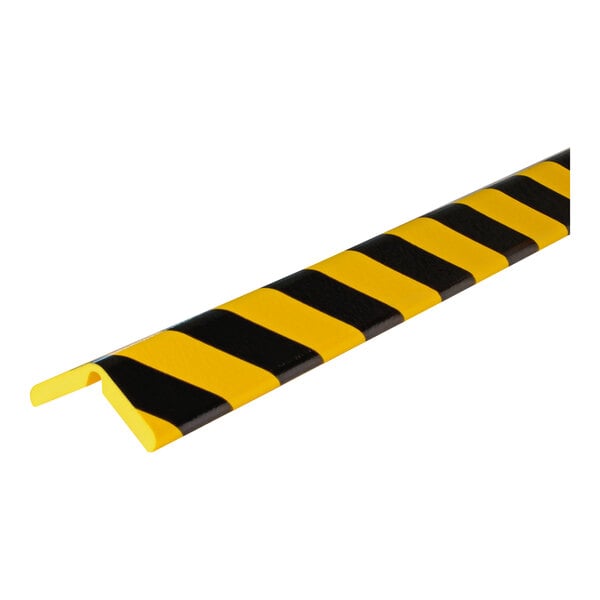 A close-up of a black and yellow striped Ideal Warehouse Knuffi Type H+ Flex Corner Guard.