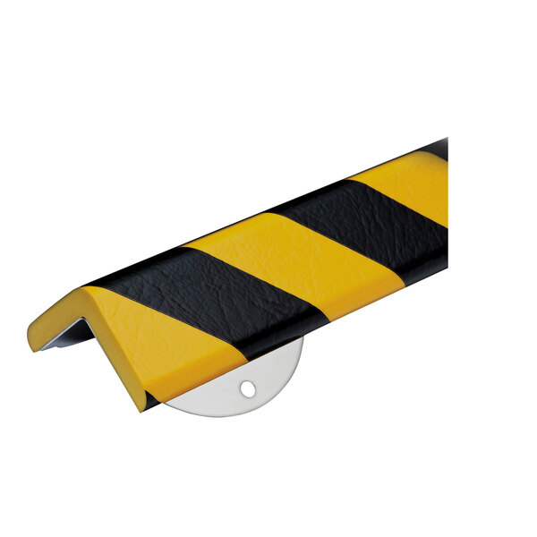 A close-up of a black and yellow striped Ideal Warehouse corner guard.