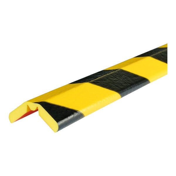 A close up of a Ideal Warehouse black and yellow striped edge guard.