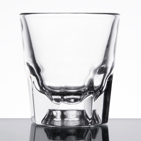 A close up of a Libbey Rocks glass filled with ice.