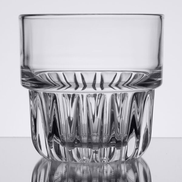 A close up of a Libbey Everest stackable rocks glass with a curved edge and a pattern.