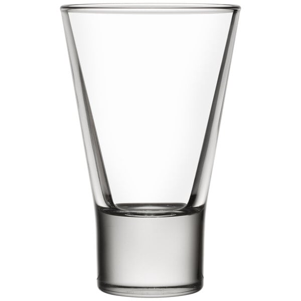 A close-up of a Libbey tall shot glass with a small rim on the top.
