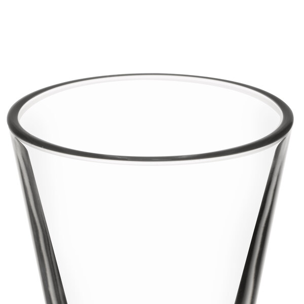 A close-up of a Libbey tall shot glass with clear glass.