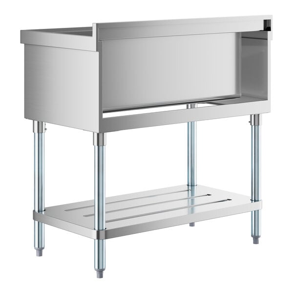 A stainless steel Regency utility sink with a shelf