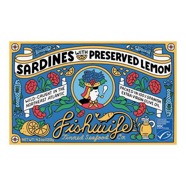 A blue and yellow Fishwife Sardines can with a woman in a hat. 