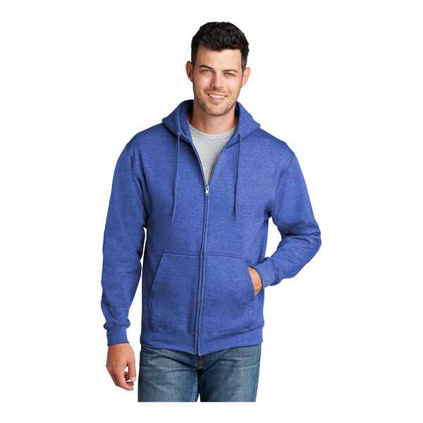 A man wearing a Port & Company heather royal full-zip hoodie.